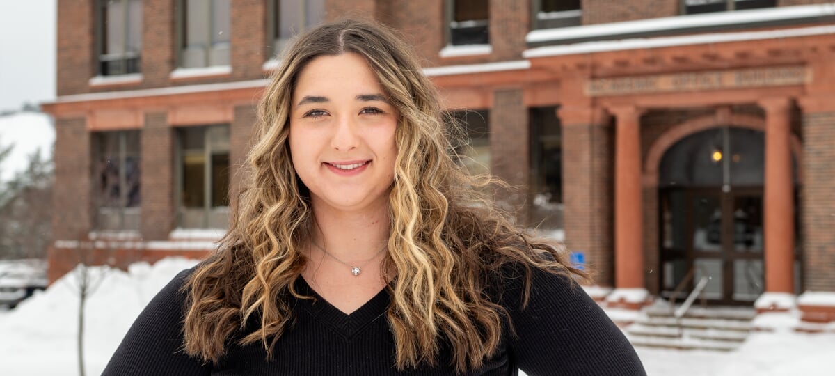 Ruby Walker funded her college education through Michigan Tech’s Leading Scholar program—and is fueling her future career as a sports marketing professional through her experiences as a marketing major, a student leader and an industry intern. Ruby Walker standing outside the Academic Office Building.