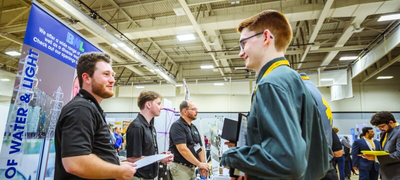 Student talking to an employer at Career Fair.