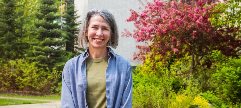 Theresa Woods standing outside on campus.