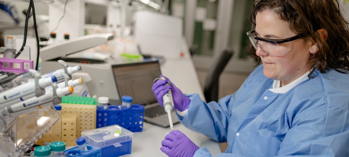 Aimee Marceau, lead for Michigan Tech’s Genomic Sequencing Lab, demonstrates the capabilities of the lab, which serves as a top-tier resource for researchers and businesses in the region and elsewhere. A research scientist for Michigan Tech’s Genomic Sequencing Lab works with equipment in the facility.