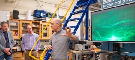 Raymond Shaw (right) and Will Cantrell (center) explain how Michigan Technological University’s Pi Cloud Chamber allows researchers to create and study clouds under carefully controlled conditions. Researchers from Brookhaven National Laboratory and Michigan Tech used the chamber to demonstrate the capabilities of a new ultra-high-resolution lidar, a laser-based remote sensing instrument for studying cloud properties.