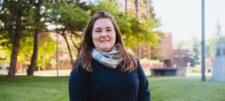 Laura Sieders standing outside on campus.