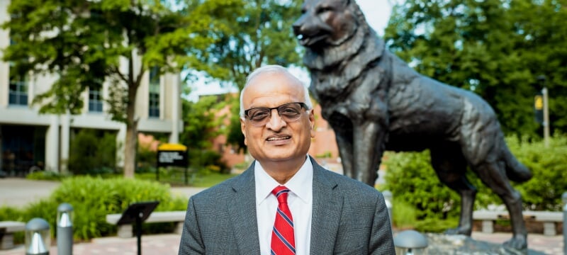 Sri Beldona, stands in front of the Husky Statue.