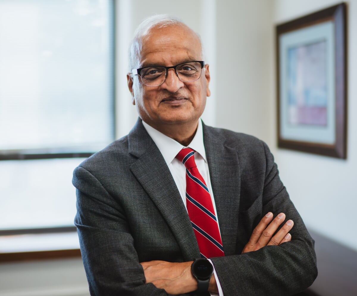 Sri Beldona standing in his office.