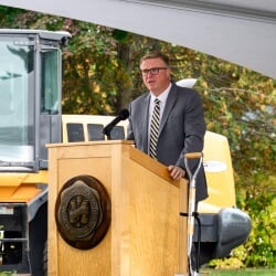 Jon Jipping speaking at the podium.
