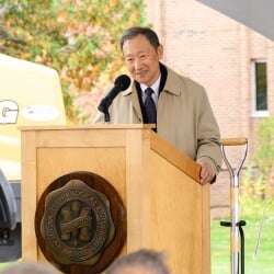 Chang K. Park speaking at the podium.