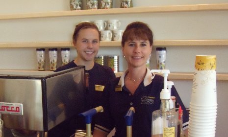 Donna Blake (right) and Brooke Asiala, a junior, cater to customers at the new library cafe.