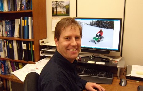 Scott Miers at desk Scott Miers