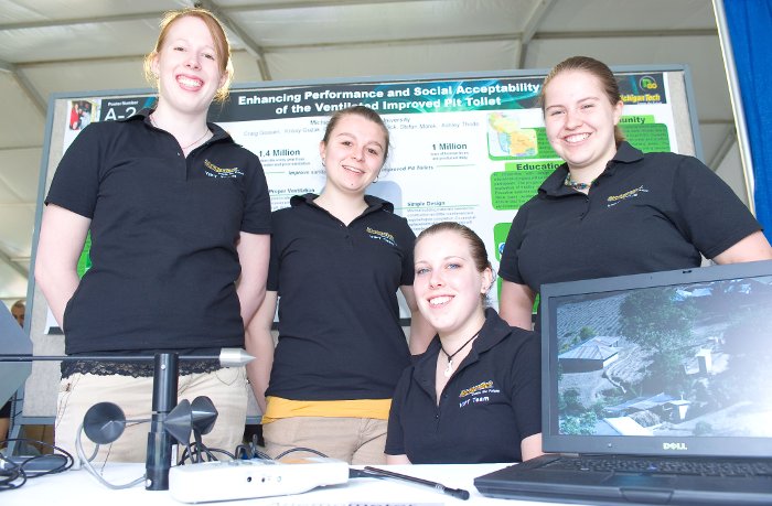 Kim Landick, Krissy Guzak, Cara Hanson and Ashley Thode explain their ventilated pit toilet at the National Sustainability Expo in Washington, DC.