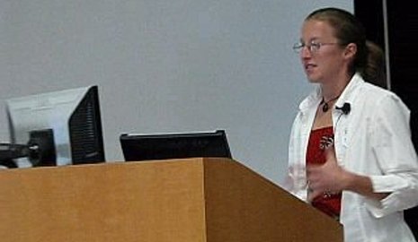 Peace Corps Master's International student Mariah Maggio addresses an international service symposium at Michigan Tech.