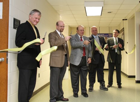 Michigan Tech President Glenn Mroz, left, cuts the ribbon for the Fernstrum Family Adaptable Classroom alongside Sean, Paul and Todd Fernstrum and Bill Predebon, chair of mechanical engineering-engineering mechanics. 