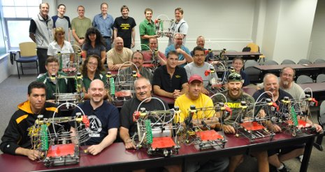 Teachers proudly display the 3D printers they made and will take back to their classrooms.  Photo used with permission: Square One Education Network