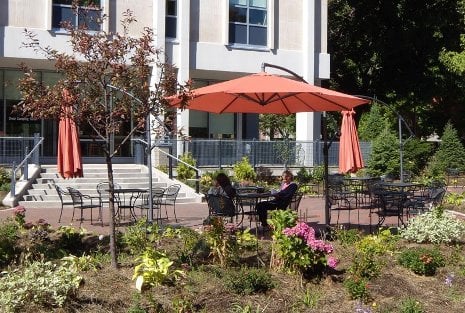 John Rovano Patio Students enjoy a break under the new umbrellas.