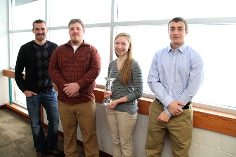 The team and their trophy, left to right, Matt Schwalen, Matt Schuman, Cora Hemmila, and Matt Younger.