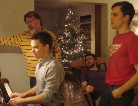 Jonathan, Don, Samuel, and Daniel singing Christmas carols.