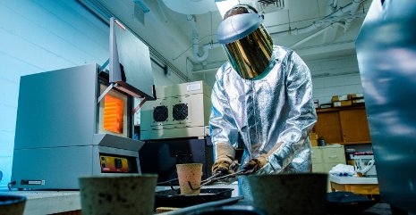 A student in the Advanced  Sustainable Iron and Steelmaking Center at Michigan Tech  learns sustainable mineral processing techniques. 