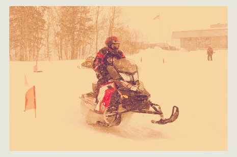 Person riding a snowmobile.