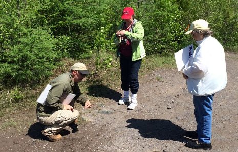 Constance Currie, right, and Christine Cox with Tim Scarlett on the location of the old family home.