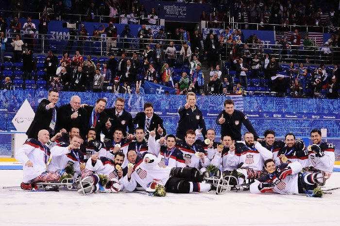 Joel Isaacson, back row, far right, celebrates with the team.