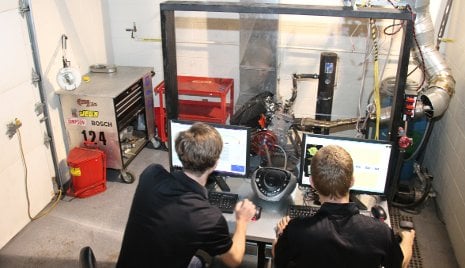 DENSO Dynamometer Lab Advanced Motorsports Enterprise students tune an engine in the new DENSO Undergraduate Dynamometer Facility.