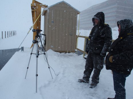 Two researchers near the shore by Michigan Tech.