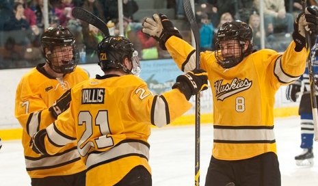 Huskies celebrate their sweep of University of Alabama Huntsville.