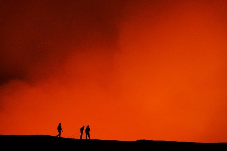 Volcano optional photo 2 Smoke glows orange above the seven and half mile-wide caldera of the volcanic island Ambrym in the Islands of Vanuatu in the South Pacific. August 2014. Credit: Simon Carn / Michigan Technological University