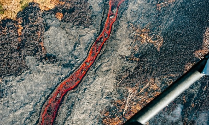 A river-like flow of red lava in Hawaii.