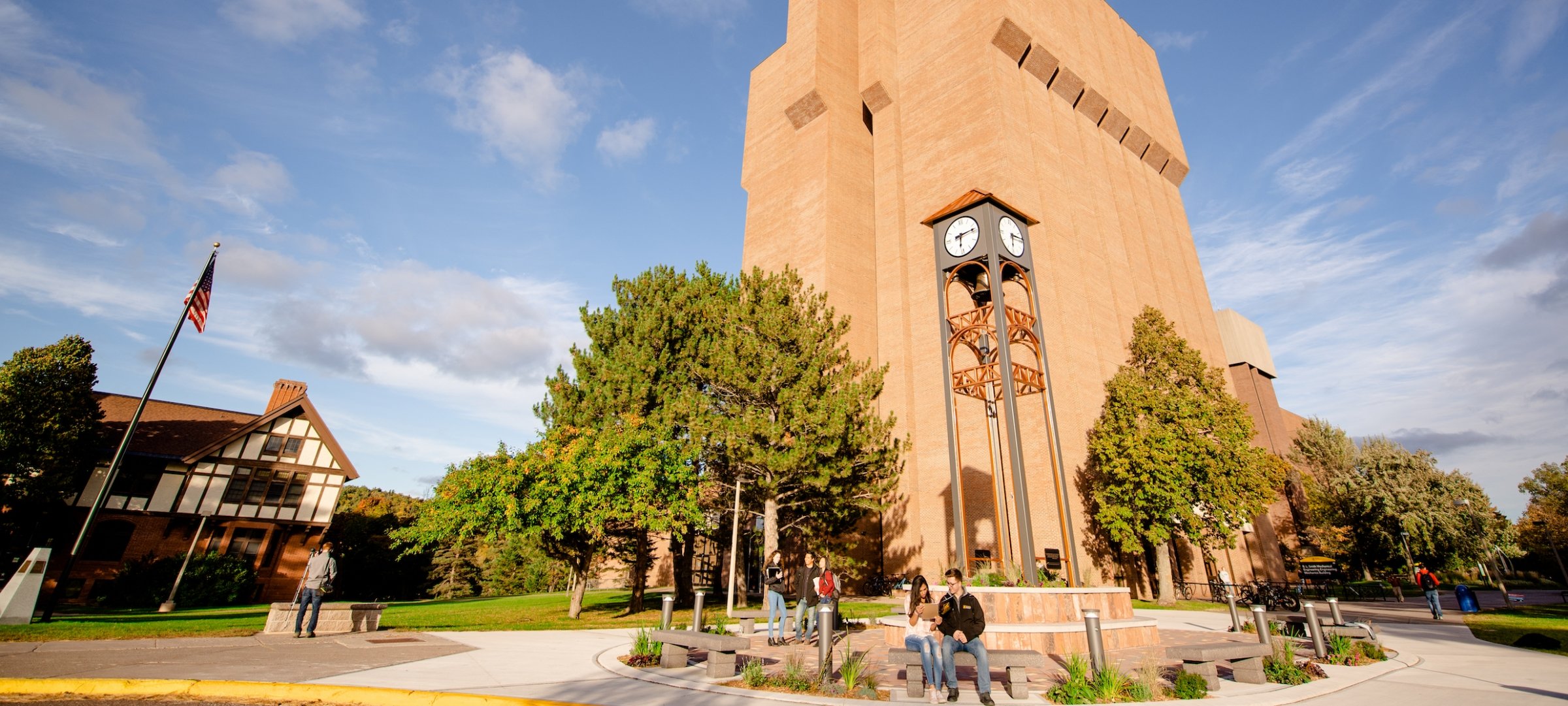 MEEM building and Michigan Tech campus mall with students in summer.