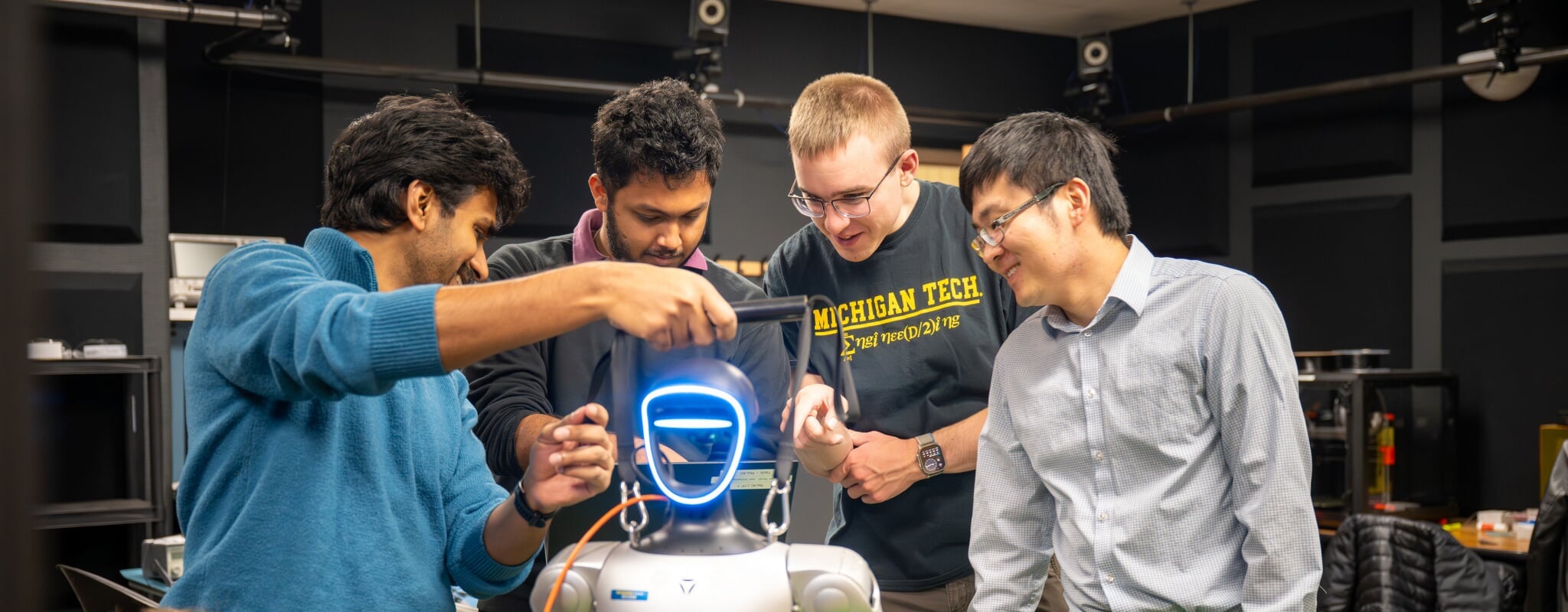 Students collaborate in the Robotics Locomotion and Applied Control (RoLAC) Lab on campus.