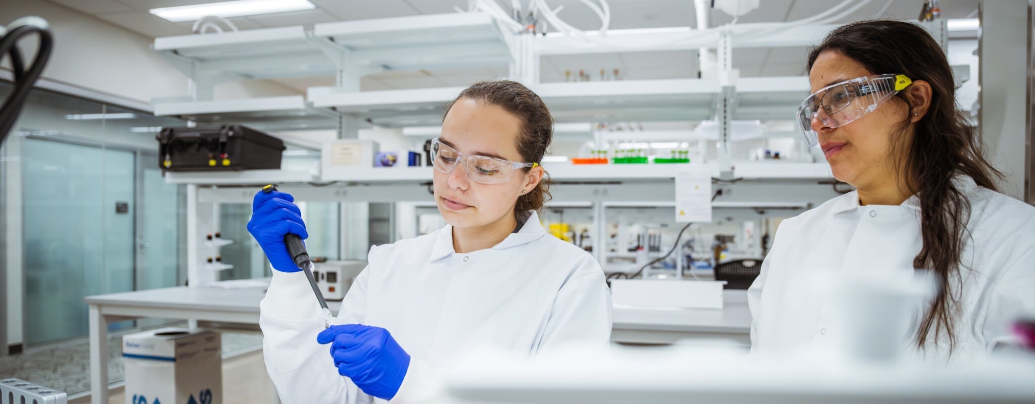 Maria Gencoglu '14 leads Samantha Cooper and a team of researchers in her cancer tissue engineering lab.