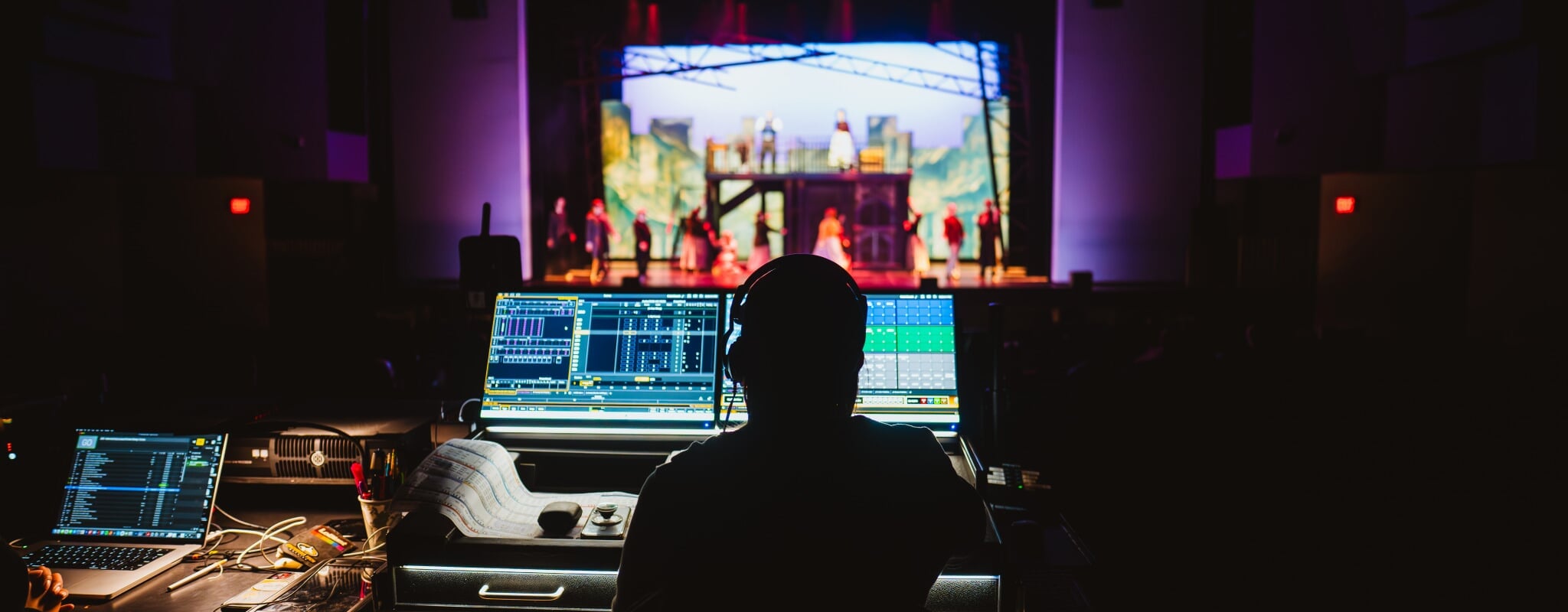 student technician working during dress rehearsal  