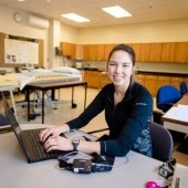 Image of Michigan Tech pre-Physical Therapy student Stephanie Dietrich working at her laptop computer