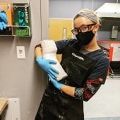 Image of Michigan Tech pre-Prosthetics and Orthotics student Allysa Meinburg holding an upper extremity cast