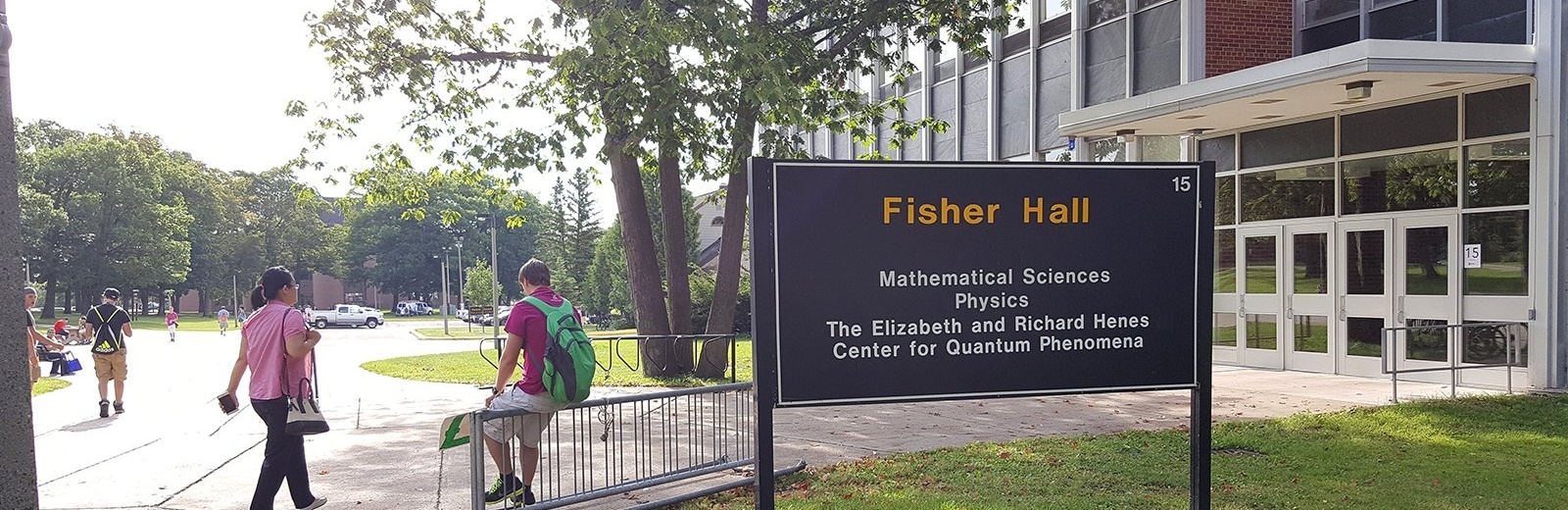 Exterior of Fisher Hall with students, location of the Elizabeth and Richard Henes Center for Quantum Phenomena