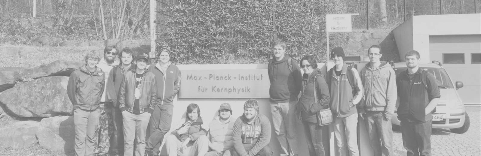 Students standing in front of of the CERN sign in Geneva, Switzerland