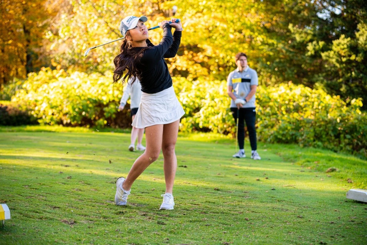 The Portage Lake Golf Course has 18 holes of distinctly different challenges. Person swinging a golf club.