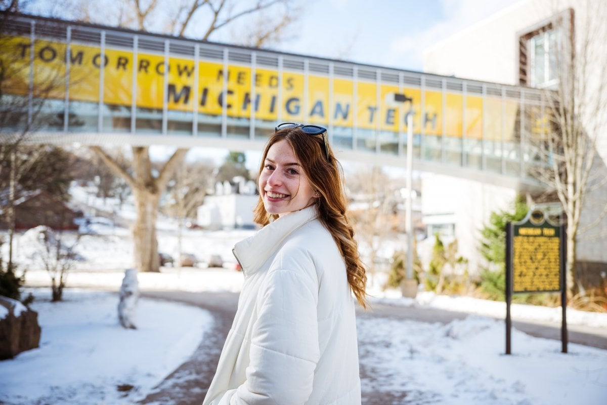 Healthy. Beautiful. Home. Tech is ranked among the safest campuses in the country. Student on campus with the Rekhi Hall to Library bridge in the background.