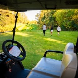 People golfing at the Portage Lake Golf Course