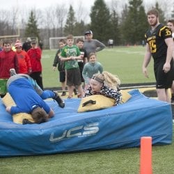 students practicing football