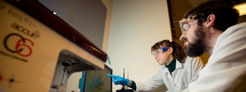 Close up of students working in a computer lab.