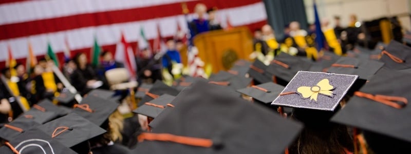 Commencement ceremony viewed from cap tops