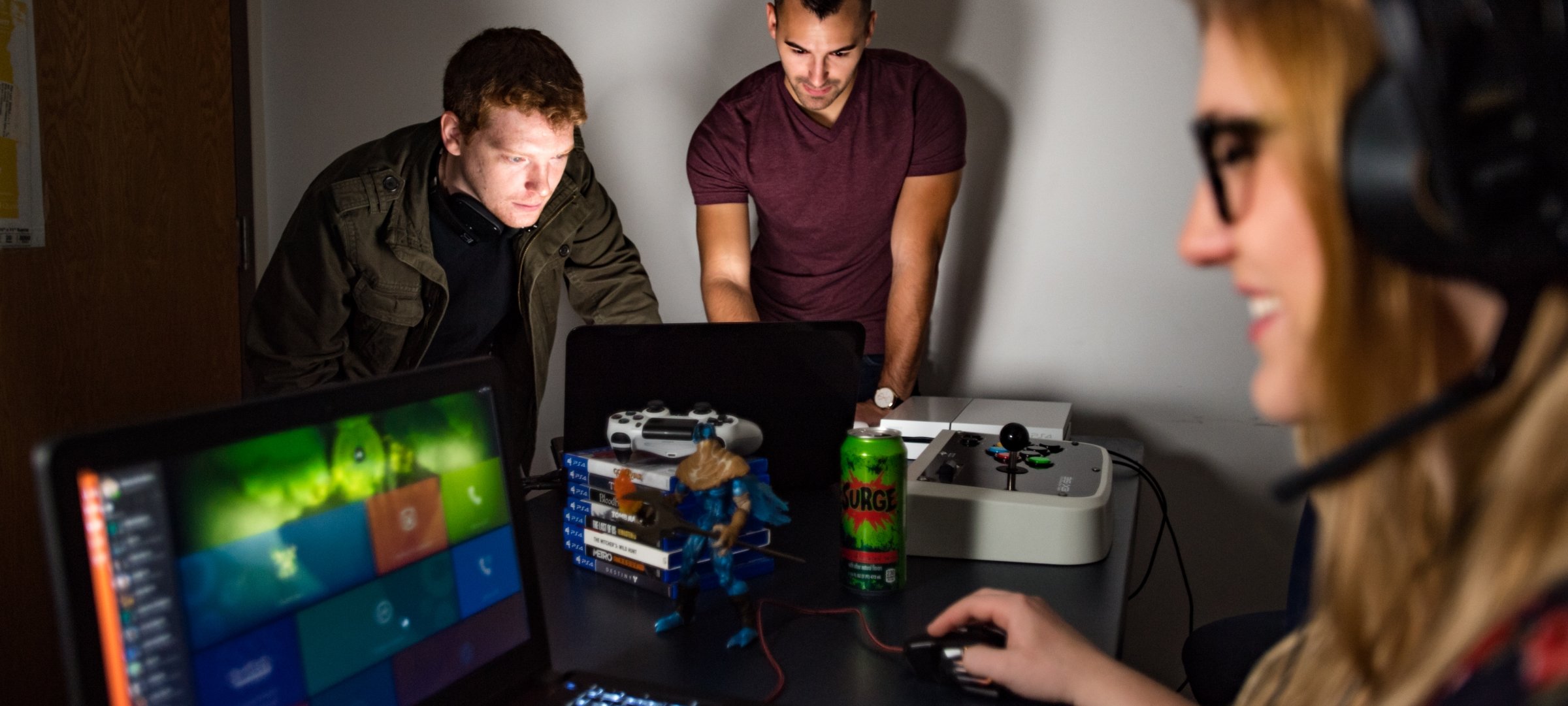 A group of researchers observe a woman using a computer