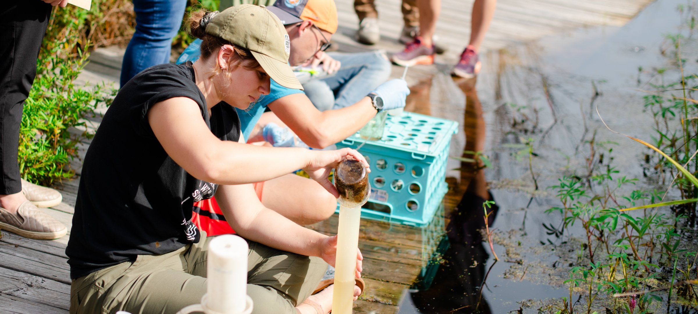 Researchers in the field gathering natural materials