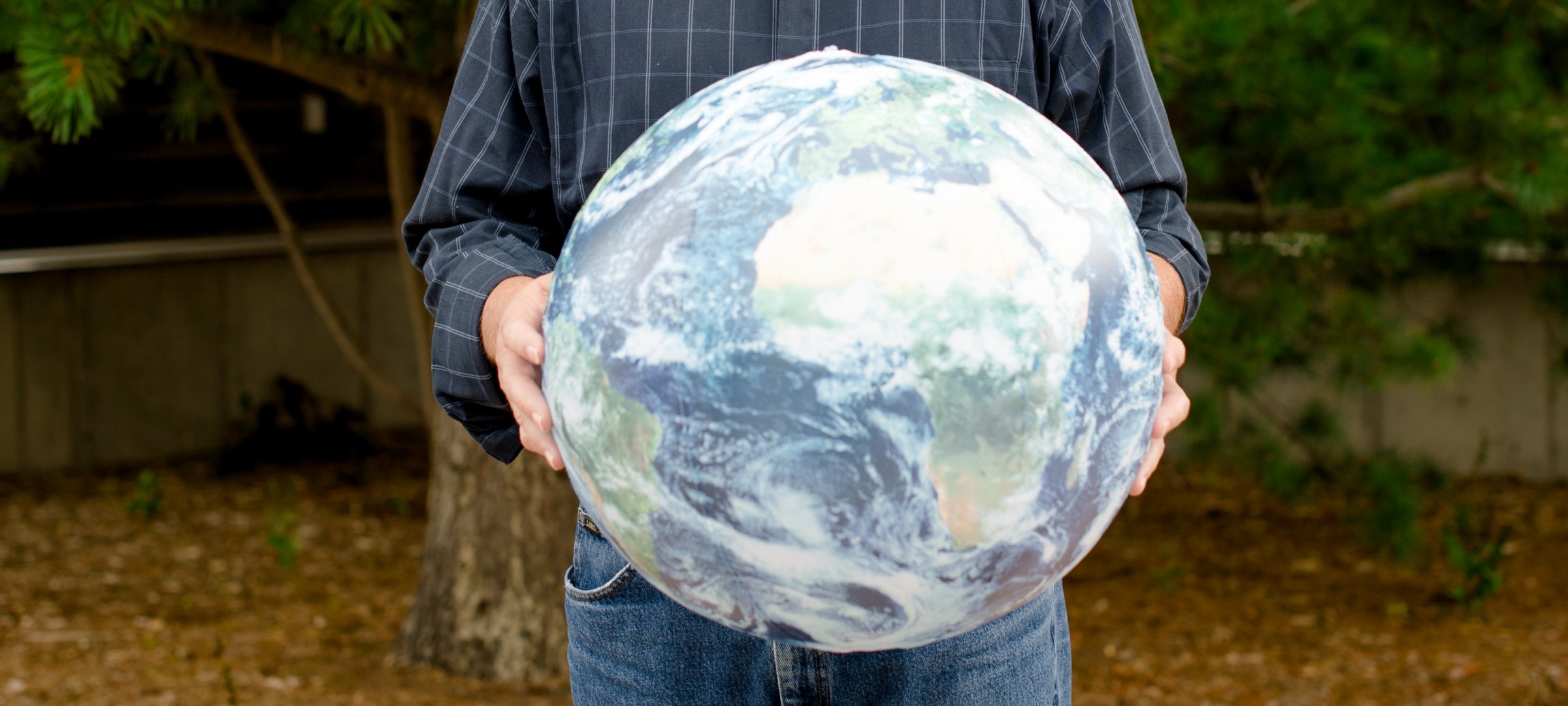 Man holding a globe