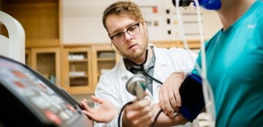 medical student monitoring blood pressure