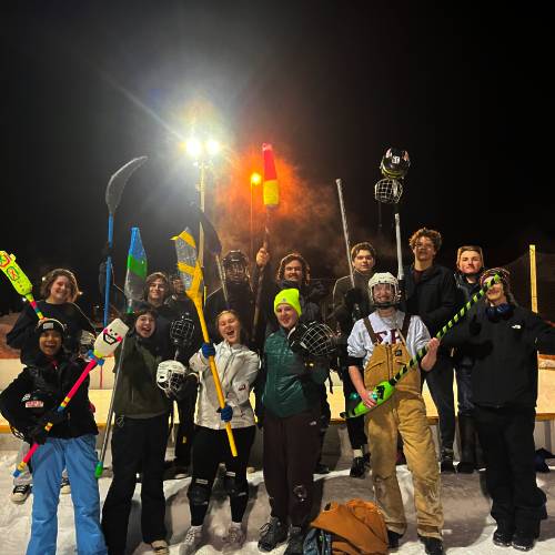 TreeHouse residents represent their floor on the broomball rink