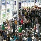 A crowd of new freshmen and their families stand in the Rozsa Center lobby.