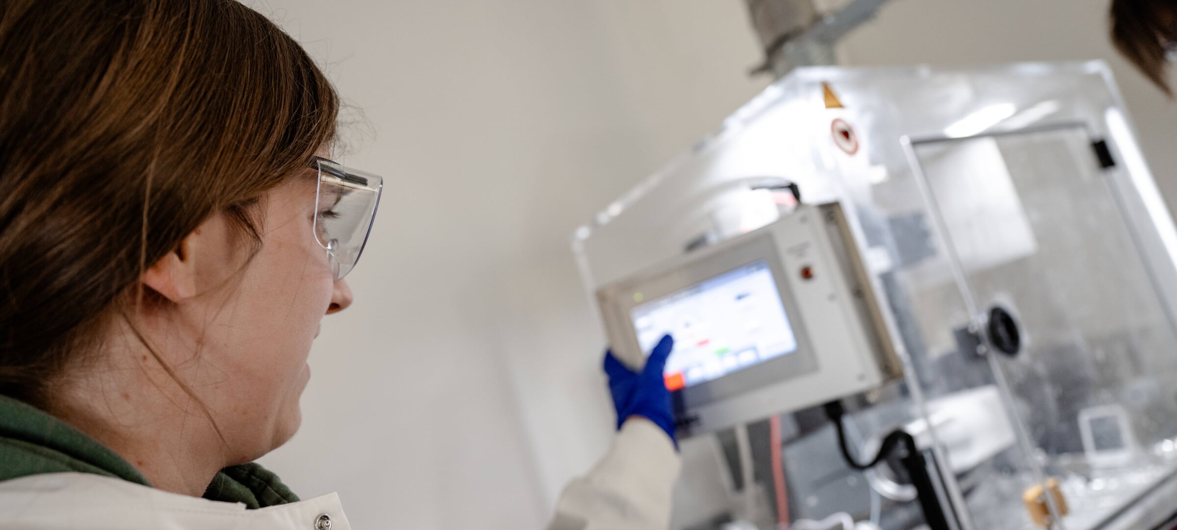 Student using equipment in a lab.