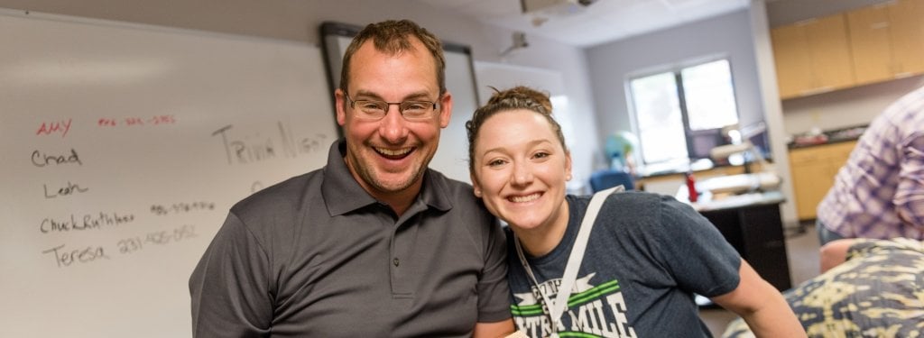 Instructor poses with student